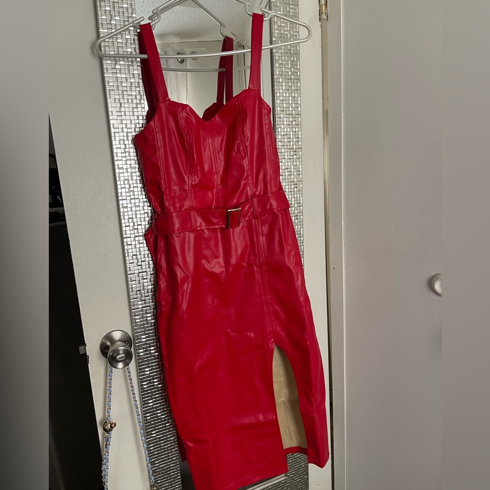 Red Leather Dress. It comes with the belt. The belt buckle is gold.